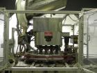 Used Resina Model U40-663 Automatic Inline Capper. Machine is capable of speeds up to 300 caps per minute. Adjustable from 10mm-70mm caps. Has top mounted cap sorter with hopper. Machine has 2HR pin ...