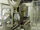 Used Resina Model U40-663 Automatic Inline Capper. Machine is capable of speeds up to 300 caps per minute. Adjustable from 10mm-70mm caps. Has top mounted cap sorter with hopper. Machine has 2HR pin ...