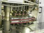Used Resina Model U40-663 Automatic Inline Capper. Machine is capable of speeds up to 300 caps per minute. Adjustable from 10mm-70mm caps. Has top mounted cap sorter with hopper. Machine has 2HR pin ...