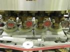 Used Resina Model U40-663 Automatic Inline Capper. Machine is capable of speeds up to 300 caps per minute. Adjustable from 10mm-70mm caps. Has top mounted cap sorter with hopper. Machine has 2HR pin ...
