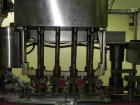 Used Resina Model U40-663 Automatic Inline Capper. Machine is capable of speeds up to 300 caps per minute. Adjustable from 10mm-70mm caps. Has top mounted cap sorter with hopper. Machine has 2HR pin ...