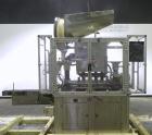 Used Resina Model U40 Automatic Inline Quill Capper. Capable of speeds up to 250 containers per minute. Cap size range 13mm to 70mm (with changeparts). Has 2HR pin style cap sorter, cap chute with no...
