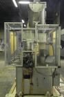 Used Resina Model U40 Automatic Inline Quill Capper. Capable of speeds up to 250 containers per minute. Cap size range 13mm to 70mm (with changeparts). Has 2HR pin style cap sorter, cap chute with no...