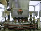 Used Resina Model U40 Automatic Inline Quill Capper. Capable of speeds up to 250 containers per minute. Cap size range 13mm to 70mm (with changeparts). Has 2HR pin style cap sorter, cap chute with no...