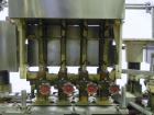 Used Resina Model U40 Automatic Inline Quill Capper. Capable of speeds up to 250 containers per minute. Cap size range 13mm to 70mm (with changeparts). Has 2HR pin style cap sorter, cap chute with no...