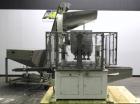Used Resina Model U40 Automatic Inline Quill Capper. Capable of speeds up to 250 containers per minute. Cap size range: 13mm to 70mm (with changeparts). Currently set up on mm caps. Has 2HR pin style...