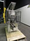 Used Resina Model U40 Automatic Inline Quill Capper. Capable of speeds up to 250 containers per minute. Cap size range: 13mm to 70mm (with changeparts). Currently set up on mm caps. Has 2HR pin style...