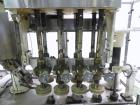 Used Resina Model U40 Automatic Inline Quill Capper. Capable of speeds up to 250 containers per minute. Cap size range: 13mm to 70mm (with changeparts). Currently set up on mm caps. Has 2HR pin style...