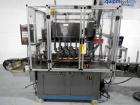 Used Resina Model U40 Automatic Inline Capper. Machine is capable of speeds up to 300 caps per minute. Is a 4 station capper with 8 spindle quills. Adjustable from 10mm-70mm caps. Has top mounted cap...