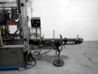 Used Resina Model U40 Automatic Inline Capper. Machine is capable of speeds up to 300 caps per minute. Is a 4 station capper with 8 spindle quills. Adjustable from 10mm-70mm caps. Has top mounted cap...