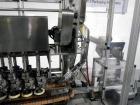 Used Resina Model U40 Automatic Inline Capper. Machine is capable of speeds up to 300 caps per minute. Is a 4 station capper with 8 spindle quills. Adjustable from 10mm-70mm caps. Has top mounted cap...