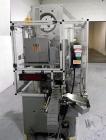 Used Resina Model U40 Automatic Inline Capper. Machine is capable of speeds up to 300 caps per minute. Is a 4 station capper with 8 spindle quills. Adjustable from 10mm-70mm caps. Has top mounted cap...