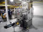 Used Resina Model U40 Automatic Inline Capper. Machine is capable of speeds up to 300 caps per minute. Is a 4 station capper with 8 spindle quills. Adjustable from 10mm-70mm caps. Has top mounted cap...