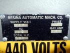 Used Resina Model U40 Automatic Inline Capper. Machine is capable of speeds up to 300 caps per minute. Is a 4 station capper with 8 spindle quills. Adjustable from 10mm-70mm caps. Has top mounted cap...