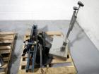 Used Resina Model U40 Automatic Inline Capper. Machine is capable of speeds up to 300 caps per minute. Is a 4 station capper with 8 spindle quills. Adjustable from 10mm-70mm caps. Has top mounted cap...