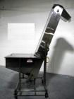 Used Resina Model U40 Automatic Inline Capper. Machine is capable of speeds up to 300 caps per minute. Is a 4 station capper with 8 spindle quills. Adjustable from 10mm-70mm caps. Has top mounted cap...