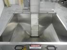 Used Resina Model U40 Automatic Inline Capper. Machine is capable of speeds up to 300 caps per minute. Is a 4 station capper with 8 spindle quills. Adjustable from 10mm-70mm caps. Has top mounted cap...