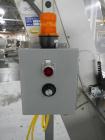 Used Resina Model U40 Automatic Inline Capper. Machine is capable of speeds up to 300 caps per minute. Is a 4 station capper with 8 spindle quills. Adjustable from 10mm-70mm caps. Has top mounted cap...