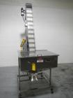 Used Resina Model U40 Automatic Inline Capper. Machine is capable of speeds up to 300 caps per minute. Is a 4 station capper with 8 spindle quills. Adjustable from 10mm-70mm caps. Has top mounted cap...