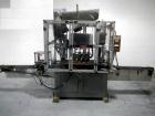 Used Resina Model U40 Automatic Inline Capper. Machine is capable of speeds up to 300 caps per minute. Is a 4 station capper with 8 spindle quills. Adjustable from 10mm-70mm caps. Has top mounted cap...