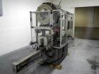 Used Resina Model U40 Automatic Inline Capper. Machine is capable of speeds up to 300 caps per minute. Is a 4 station capper with 8 spindle quills. Adjustable from 10mm-70mm caps. Has top mounted cap...