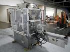 Used Resina Model U40 Automatic Inline Capper. Machine is capable of speeds up to 300 caps per minute. Is a 4 station capper with 8 spindle quills. Adjustable from 10mm-70mm caps. Has top mounted cap...