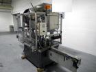 Used Resina Model U40 Automatic Inline Capper. Machine is capable of speeds up to 300 caps per minute. Is a 4 station capper with 8 spindle quills. Adjustable from 10mm-70mm caps. Has top mounted cap...
