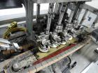 Used Resina Model U40 Automatic Inline Capper. Machine is capable of speeds up to 300 caps per minute. Is a 4 station capper with 8 spindle quills. Adjustable from 10mm-70mm caps. Has top mounted cap...