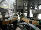 Used Resina Model U40 Automatic Inline Capper. Machine is capable of speeds up to 300 caps per minute. Is a 4 station capper with 8 spindle quills. Adjustable from 10mm-70mm caps. Has top mounted cap...