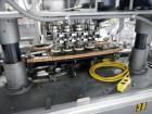 Used Resina Model U40 Automatic Inline Capper. Machine is capable of speeds up to 300 caps per minute. Is a 4 station capper with 8 spindle quills. Adjustable from 10mm-70mm caps. Has top mounted cap...
