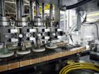 Used Resina Model U40 Automatic Inline Capper. Machine is capable of speeds up to 300 caps per minute. Is a 4 station capper with 8 spindle quills. Adjustable from 10mm-70mm caps. Has top mounted cap...