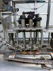 Used- Resina Model UN30 Automatic Inline Quill Screw Capper