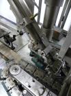 Used Resina Inline Quill Capper, 8 Quill, Model UN40-1250. Capable of speeds over 250 Bottles per minute. Has a cap size range from 13 - 70mm (with changeparts). Has a vertical pin style sorter for c...