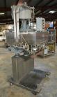 Used Sure Kap SK6000 Quill capper. Three spindle capper with adjustable chute will handle caps from 13 to 110MM w/o changeparts. Has dual gripper belts, C frame construction will mount up to any conv...