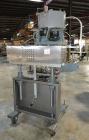 Used Sure Kap SK6000 Quill capper. Three spindle capper with adjustable chute will handle caps from 13 to 110MM w/o changeparts. Has dual gripper belts, C frame construction will mount up to any conv...