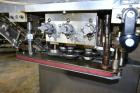 Used Sure Kap SK6000 Quill capper. Three spindle capper with adjustable chute will handle caps from 13 to 110MM w/o changeparts. Has dual gripper belts, C frame construction will mount up to any conv...