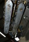 Used Sure Kap SK6000 Quill capper. Three spindle capper with adjustable chute will handle caps from 13 to 110MM w/o changeparts. Has dual gripper belts, C frame construction will mount up to any conv...