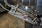 Used Sure Kap SK6000 Quill capper. Three spindle capper with adjustable chute will handle caps from 13 to 110MM w/o changeparts. Has dual gripper belts, C frame construction will mount up to any conv...