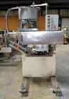 Used Sure Kap SK6000-18 Quill capper. Three spindle capper with adjustable chute will handle caps from 13 to 110MM w/o changeparts. Has dual gripper belts, C frame construction will mount up to any c...