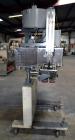 Used Sure Kap SK6000-18 Quill capper. Three spindle capper with adjustable chute will handle caps from 13 to 110MM w/o changeparts. Has dual gripper belts, C frame construction will mount up to any c...