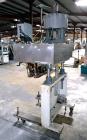 Used Sure Kap SK6000-18 Quill capper. Three spindle capper with adjustable chute will handle caps from 13 to 110MM w/o changeparts. Has dual gripper belts, C frame construction will mount up to any c...