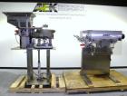 Used SureKap Fully Automatic Straight Line Six Spindle Quill Capper, Model SK6000-SP. Capacities 100 bottles per minute depending on size and conveyor speed. Cap Size Range: diameter 8mm to 110mm (Ma...