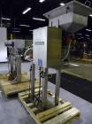 Used SureKap Fully Automatic Straight Line Six Spindle Quill Capper, Model SK6000-SP. Capacities 100 bottles per minute depending on size and conveyor speed. Cap Size Range: diameter 8mm to 110mm (Ma...