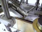 Used SureKap Fully Automatic Straight Line Six Spindle Quill Capper, Model SK6000-SP. Capacities 100 bottles per minute depending on size and conveyor speed. Cap Size Range: diameter 8mm to 110mm (Ma...