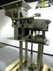 Used SureKap Fully Automatic Straight Line Six Spindle Quill Capper, Model SK6000-SP. Capacities 100 bottles per minute depending on size and conveyor speed. Cap Size Range: diameter 8mm to 110mm (Ma...