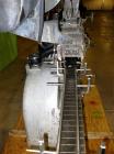 Used White Cap Vacuum Steam Flow Capper, Model VG2200LJG. Includes a cap hopper, and a 4 1/2
