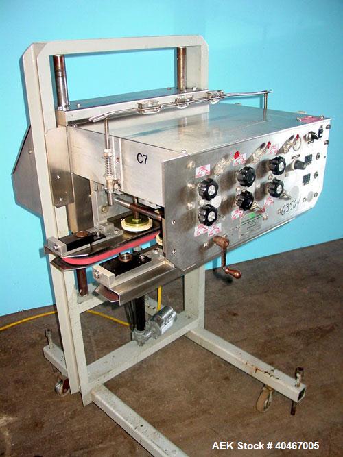 Used Elf model AC1600 (6) quill cap tightener. 3 sets of quills, last set of quills with mechanical clutch for torque application, 24 in long x 3/4 in single rubber bottle gripper belts, belt and gri...