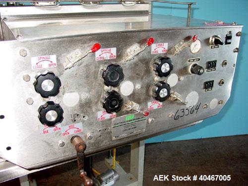 Used Elf model AC1600 (6) quill cap tightener. 3 sets of quills, last set of quills with mechanical clutch for torque application, 24 in long x 3/4 in single rubber bottle gripper belts, belt and gri...