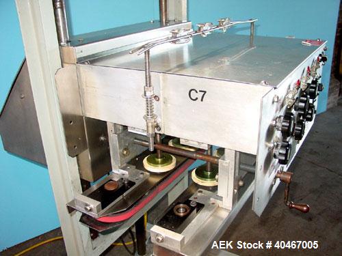 Used Elf model AC1600 (6) quill cap tightener. 3 sets of quills, last set of quills with mechanical clutch for torque application, 24 in long x 3/4 in single rubber bottle gripper belts, belt and gri...