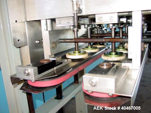 Used Elf model AC1600 (6) quill cap tightener. 3 sets of quills, last set of quills with mechanical clutch for torque application, 24 in long x 3/4 in single rubber bottle gripper belts, belt and gri...